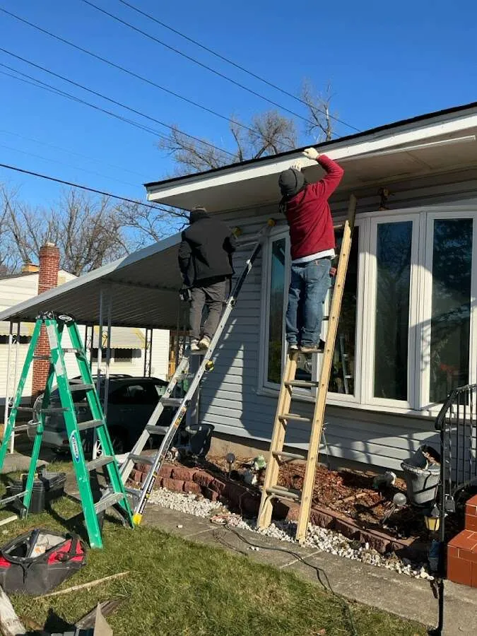 Restoration crew performing exterior repair in Walton